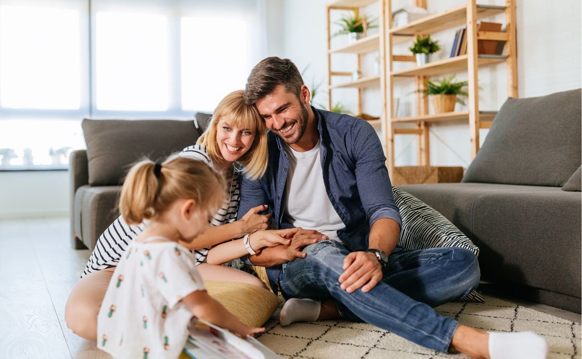 a family sitting in a living room enjoying clean air quality due to clean air filters and dehumidifiers 