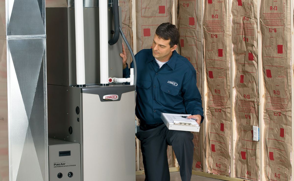 a hvac contractor inspecting a lennox hvac system and performing a diagnostic